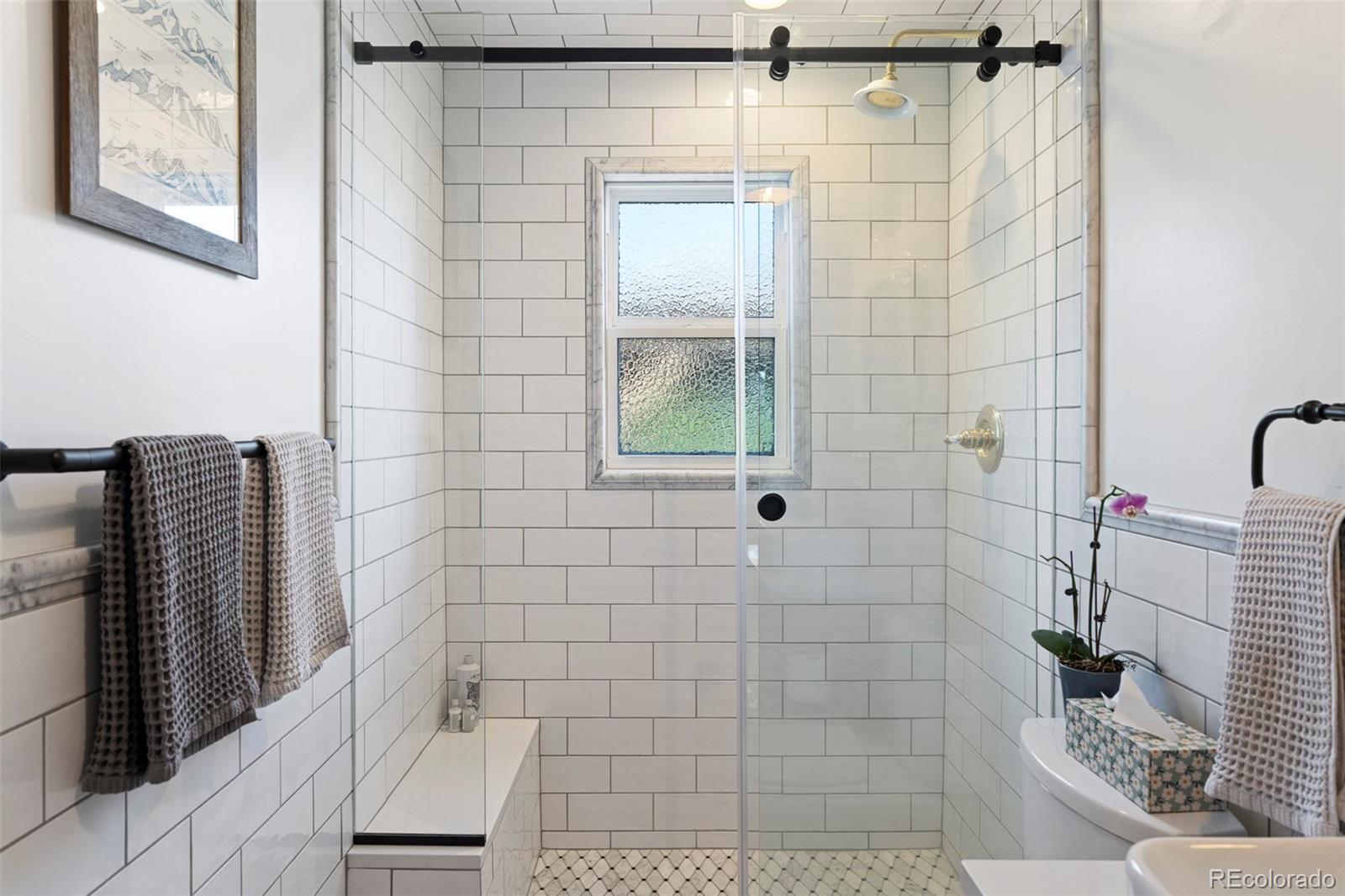 2073 South Perry Park Road Sedalia, CO 80135 - Photo 10 of 41 a bathroom with a shower and a sink