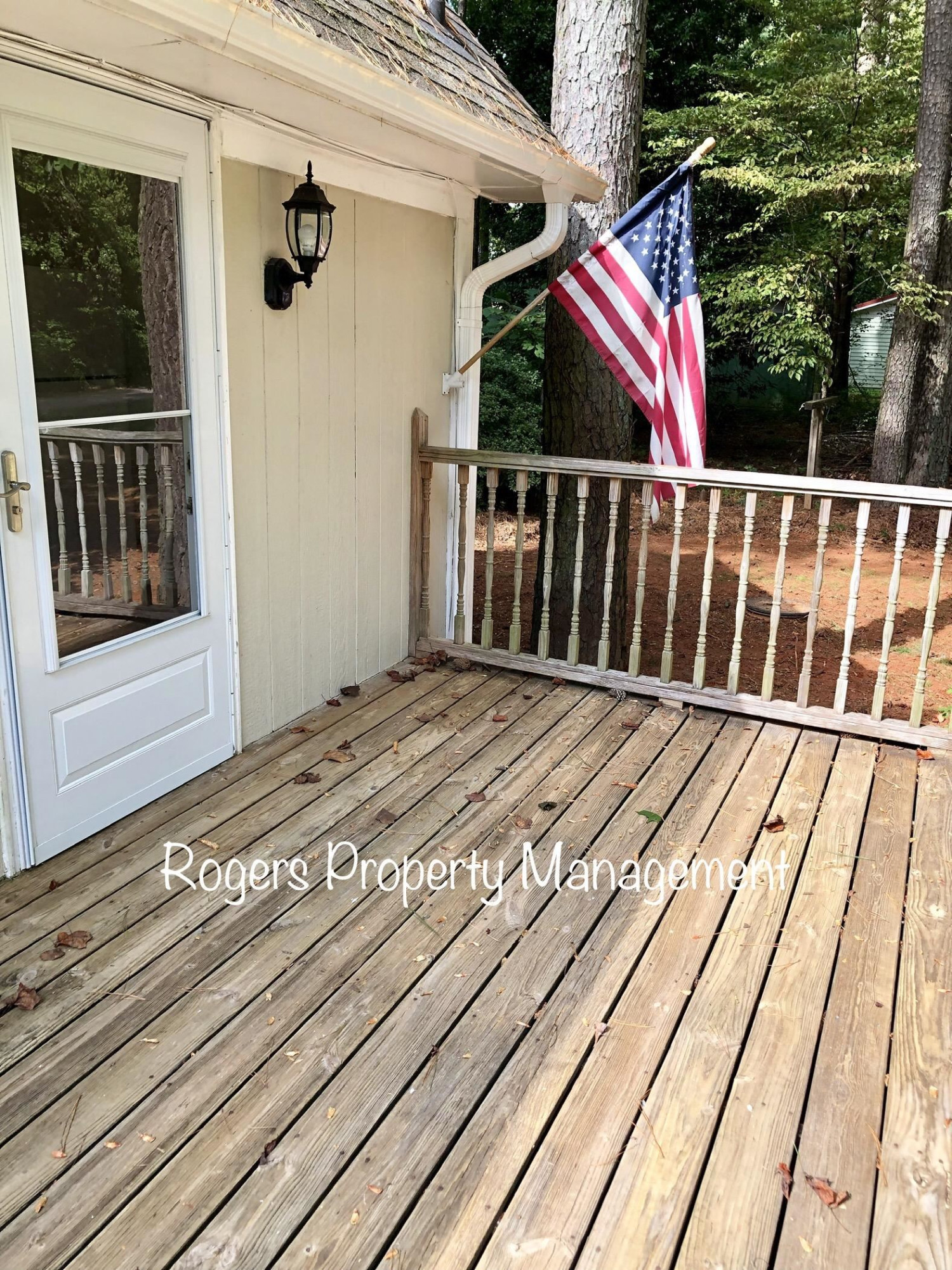 5409 Bobbitt Road Apex, NC 27539 - Photo 2 of 19 a view of balcony with wooden floor and fence