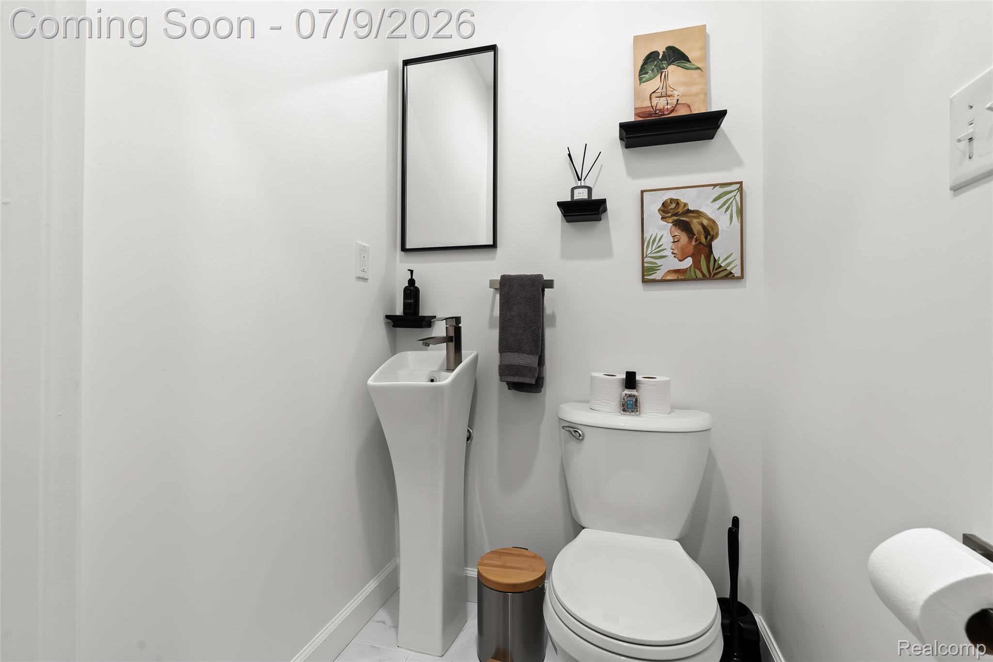 2566 Harrington Road Rochester, MI 48307 - Photo 10 of 64 Powder room off the kitchen and office workspace
