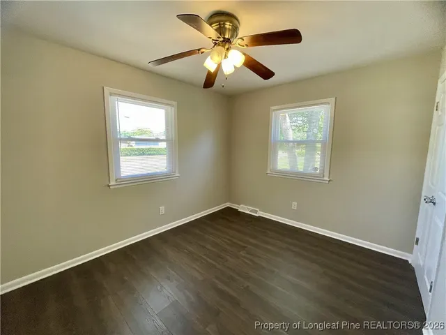 a view of room with window and ceiling fan