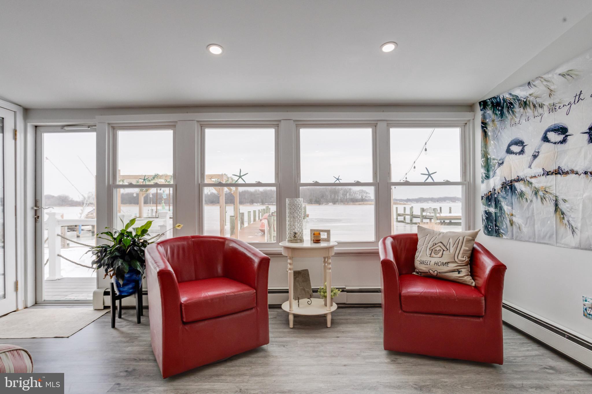 1815 Wilson Point Road Middle River, MD 21220 - Photo 11 of 76 a living room with furniture and a large window