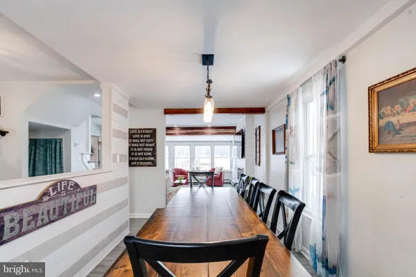 a dining room with furniture and window