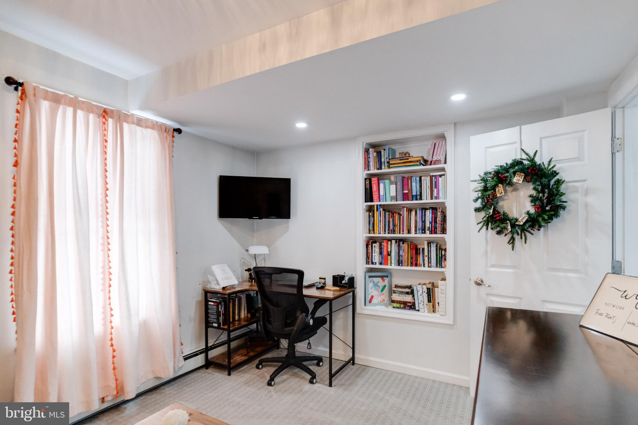 1815 Wilson Point Road Middle River, MD 21220 - Photo 31 of 76 a view of a livingroom with furniture and a bookshelf