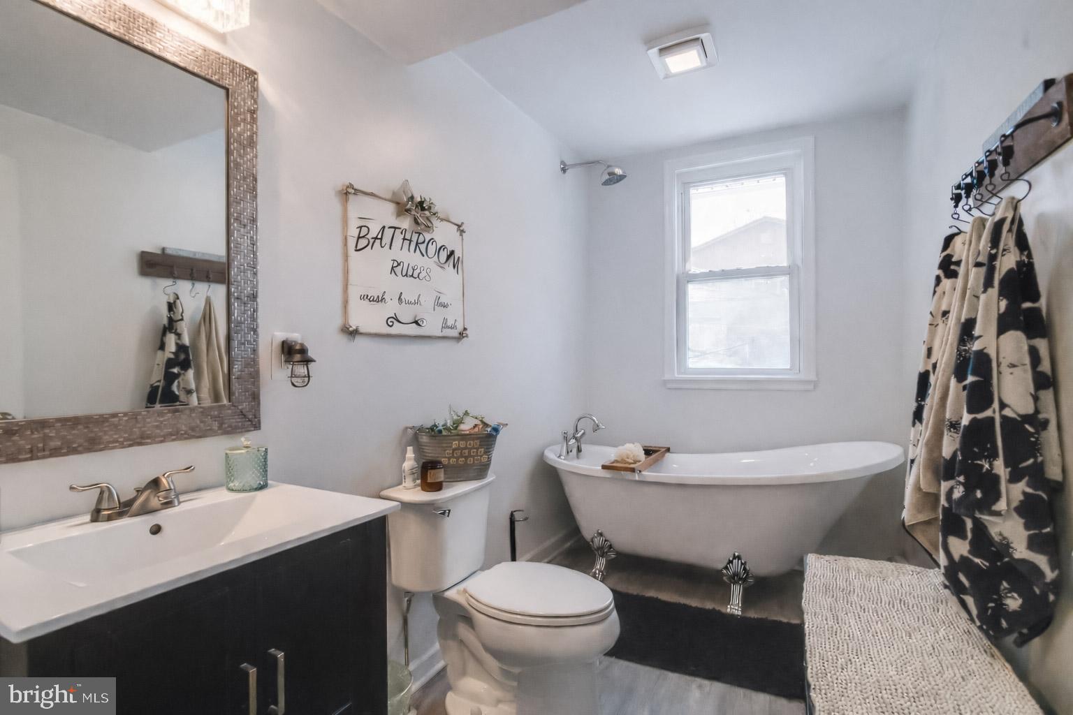 1815 Wilson Point Road Middle River, MD 21220 - Photo 33 of 76 a bathroom with a toilet sink and mirror