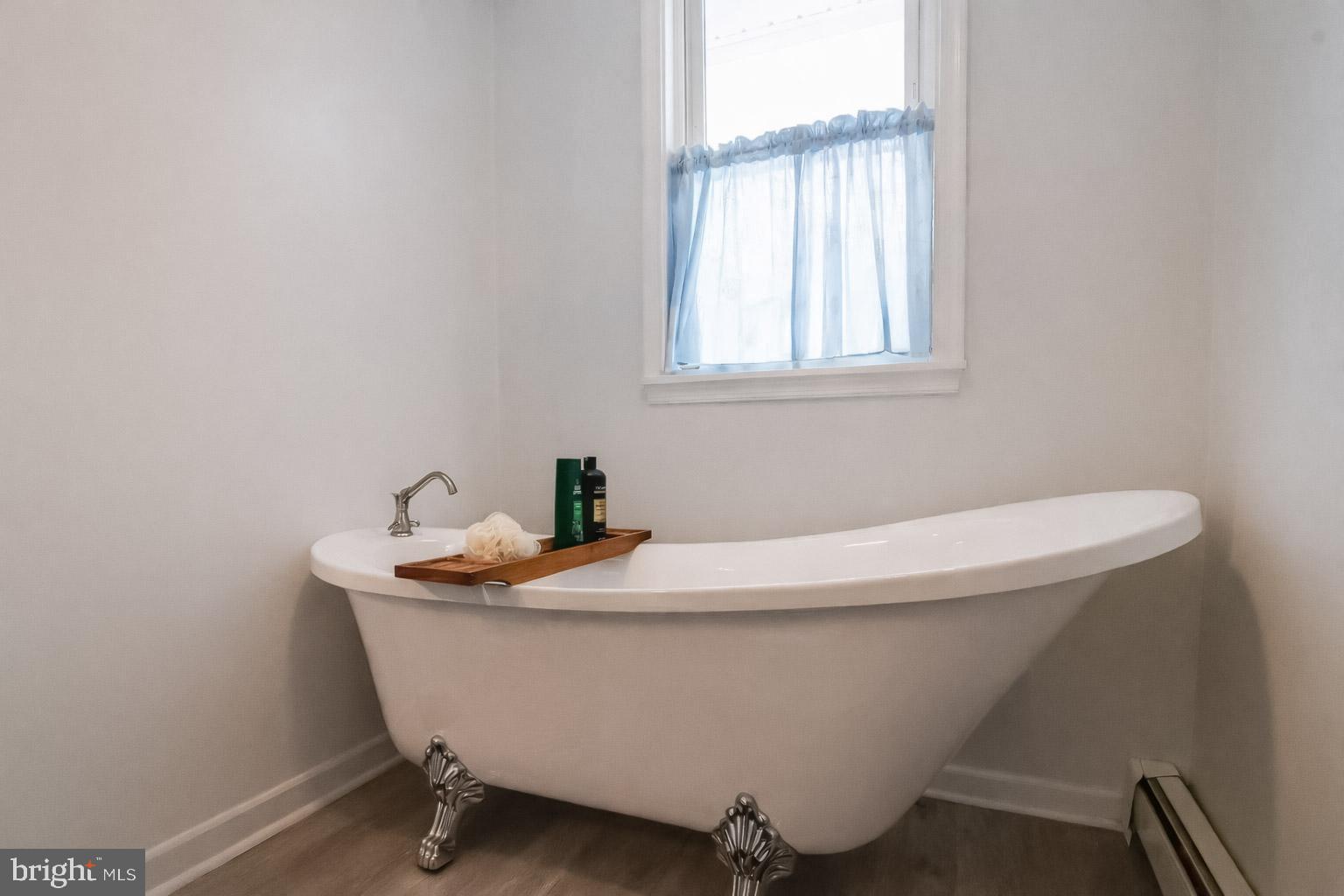 1815 Wilson Point Road Middle River, MD 21220 - Photo 34 of 76 a white bath tub sitting in a bathroom