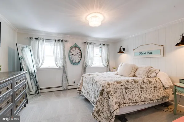a bedroom with a bed and a table in it