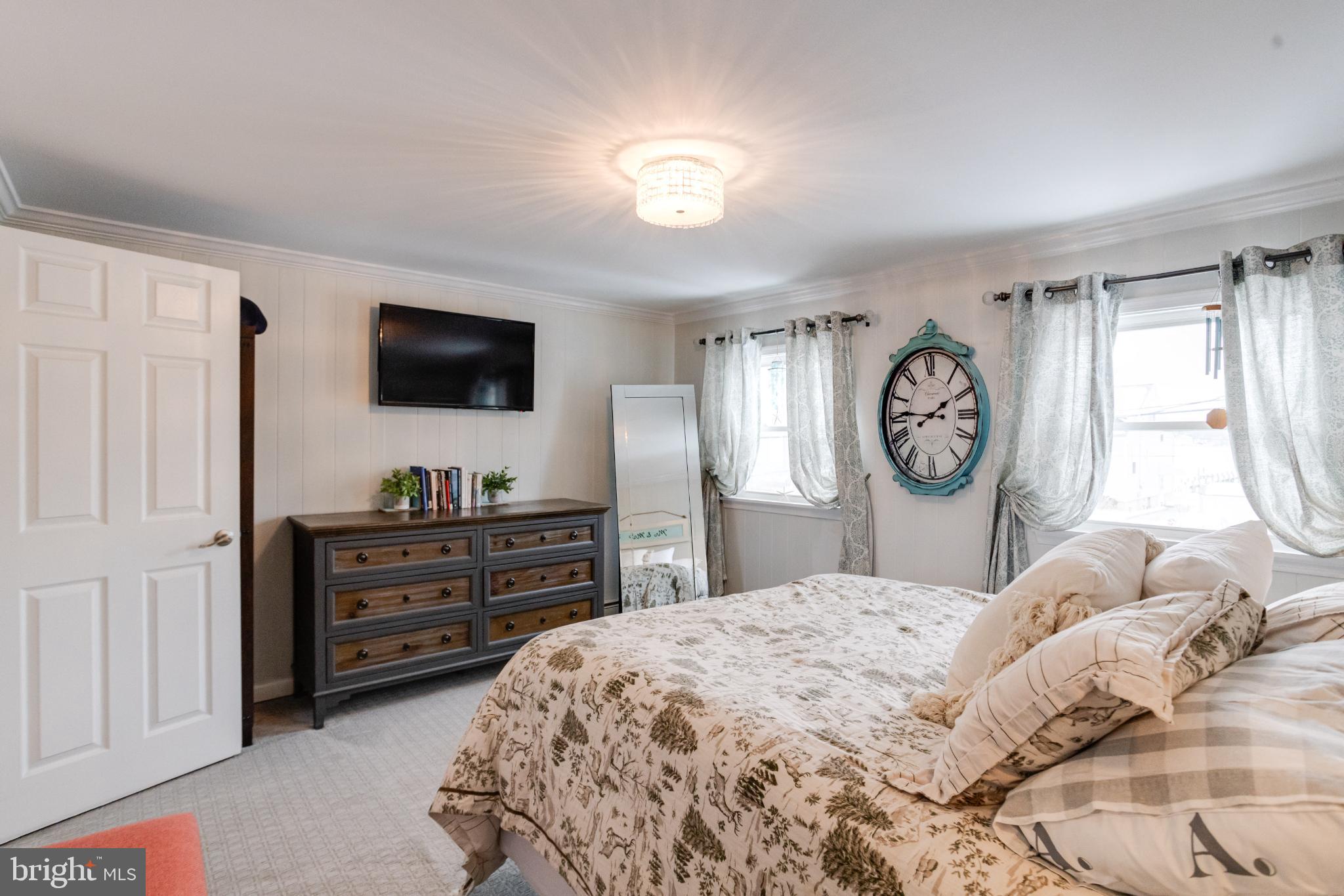 1815 Wilson Point Road Middle River, MD 21220 - Photo 38 of 76 a bedroom with a bed and a flat screen tv