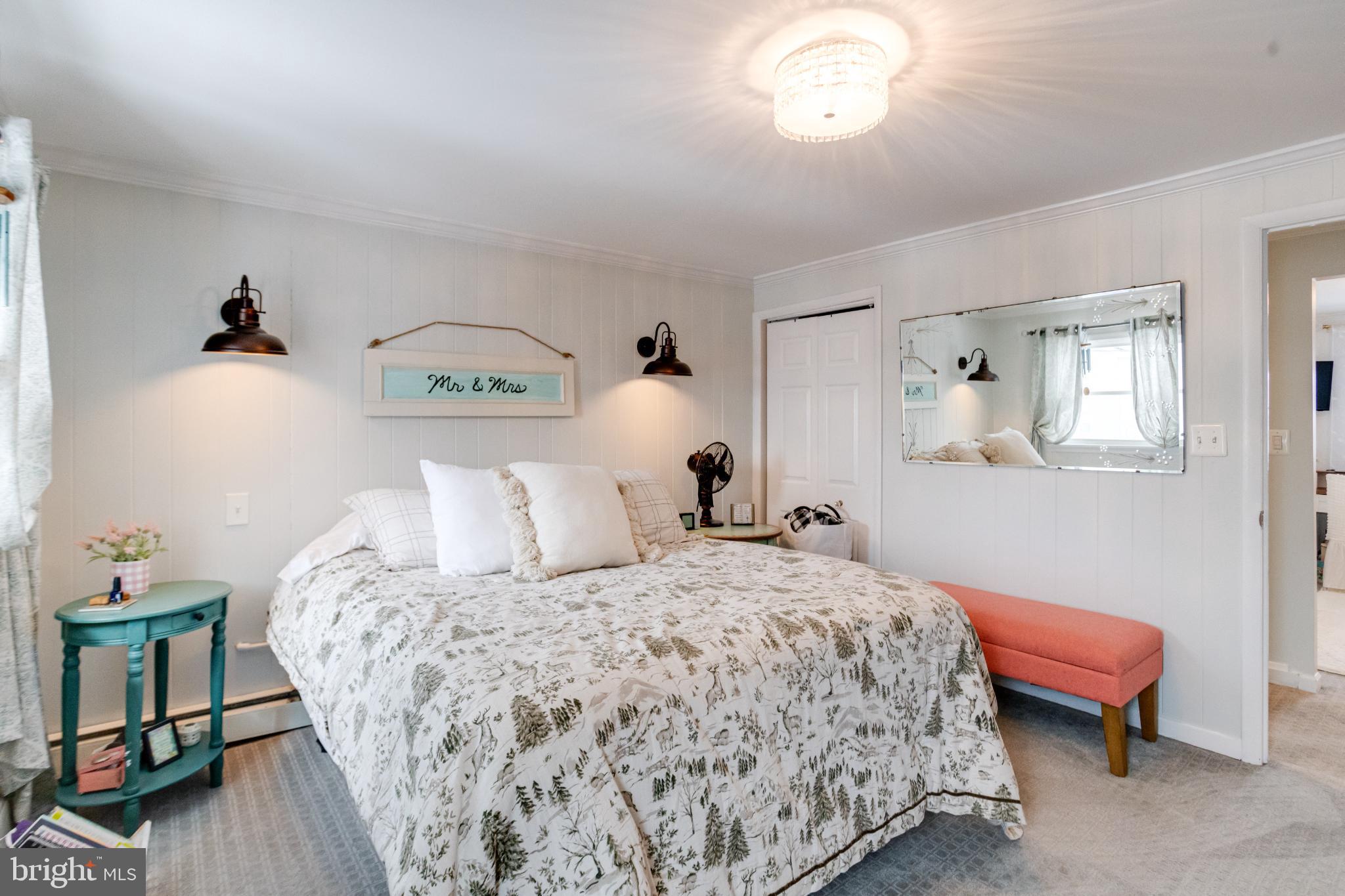 1815 Wilson Point Road Middle River, MD 21220 - Photo 39 of 76 a bedroom with a bed and a table in it