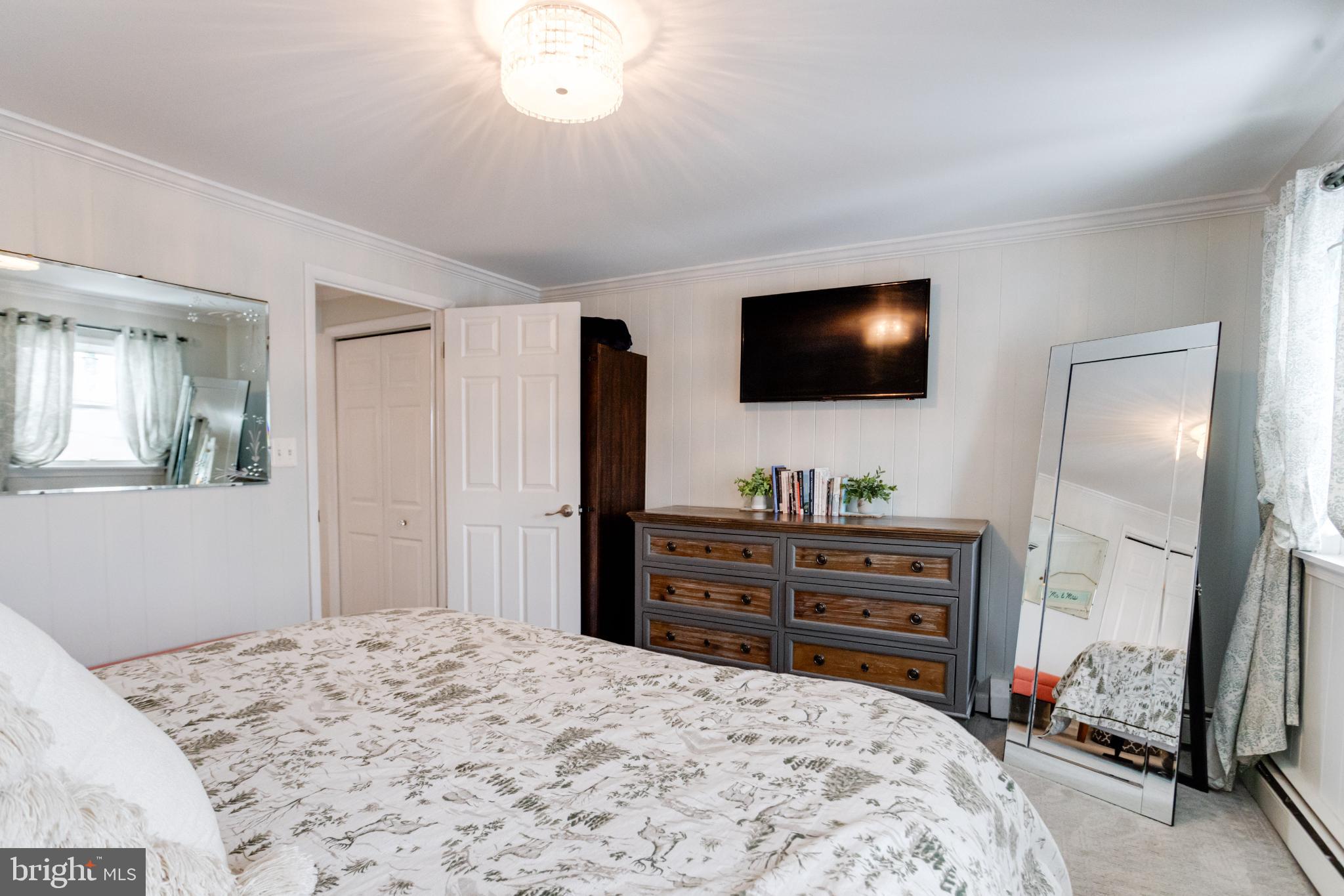 1815 Wilson Point Road Middle River, MD 21220 - Photo 40 of 76 a bedroom with a bed and a flat screen tv