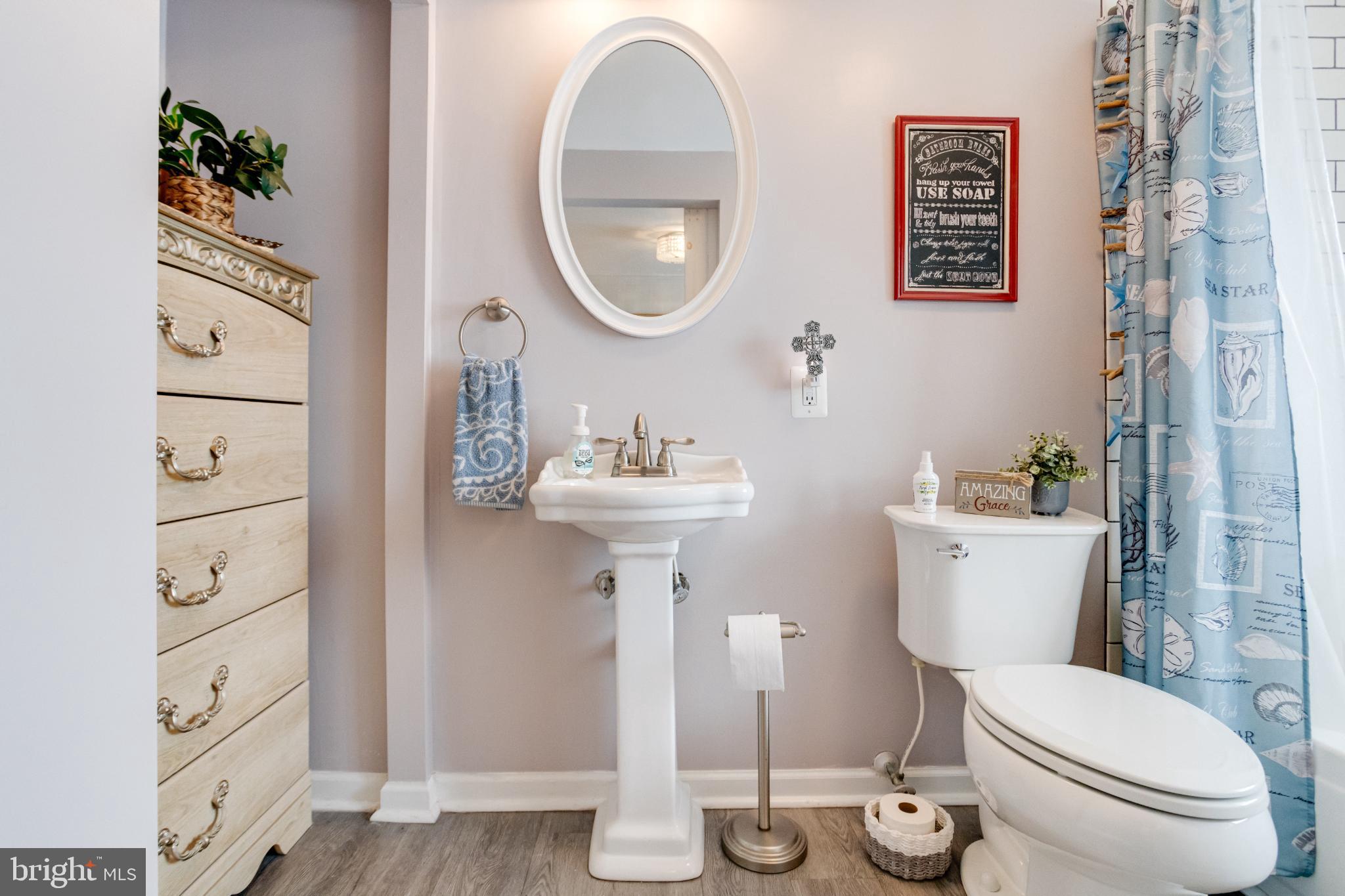 1815 Wilson Point Road Middle River, MD 21220 - Photo 44 of 76 a bathroom with a toilet a sink and a mirror