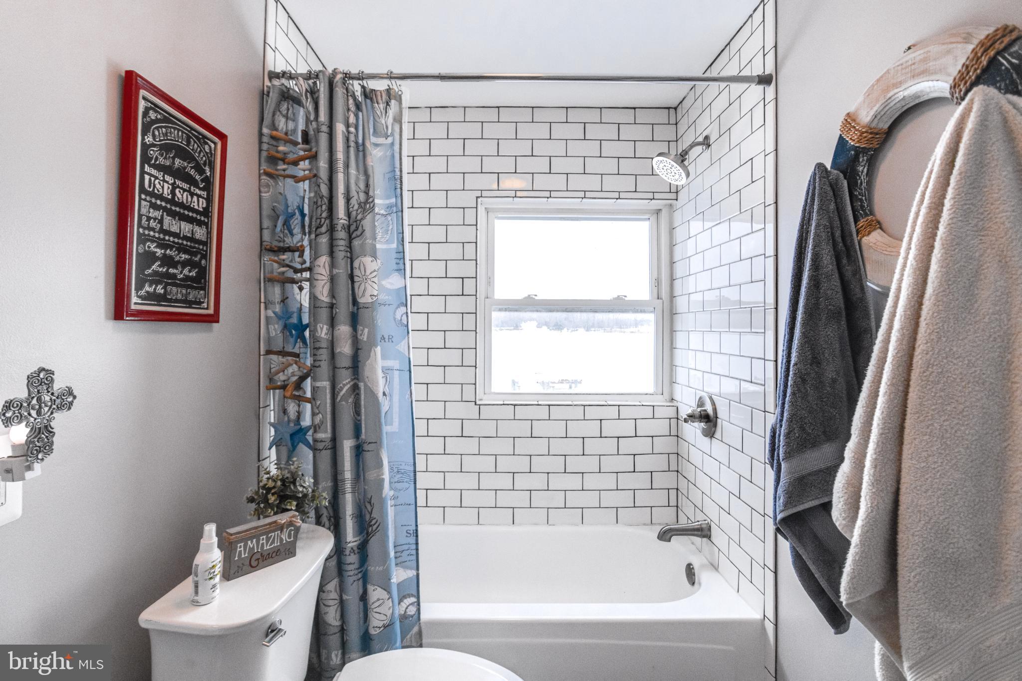 1815 Wilson Point Road Middle River, MD 21220 - Photo 45 of 76 a bathroom with a shower and a toilet