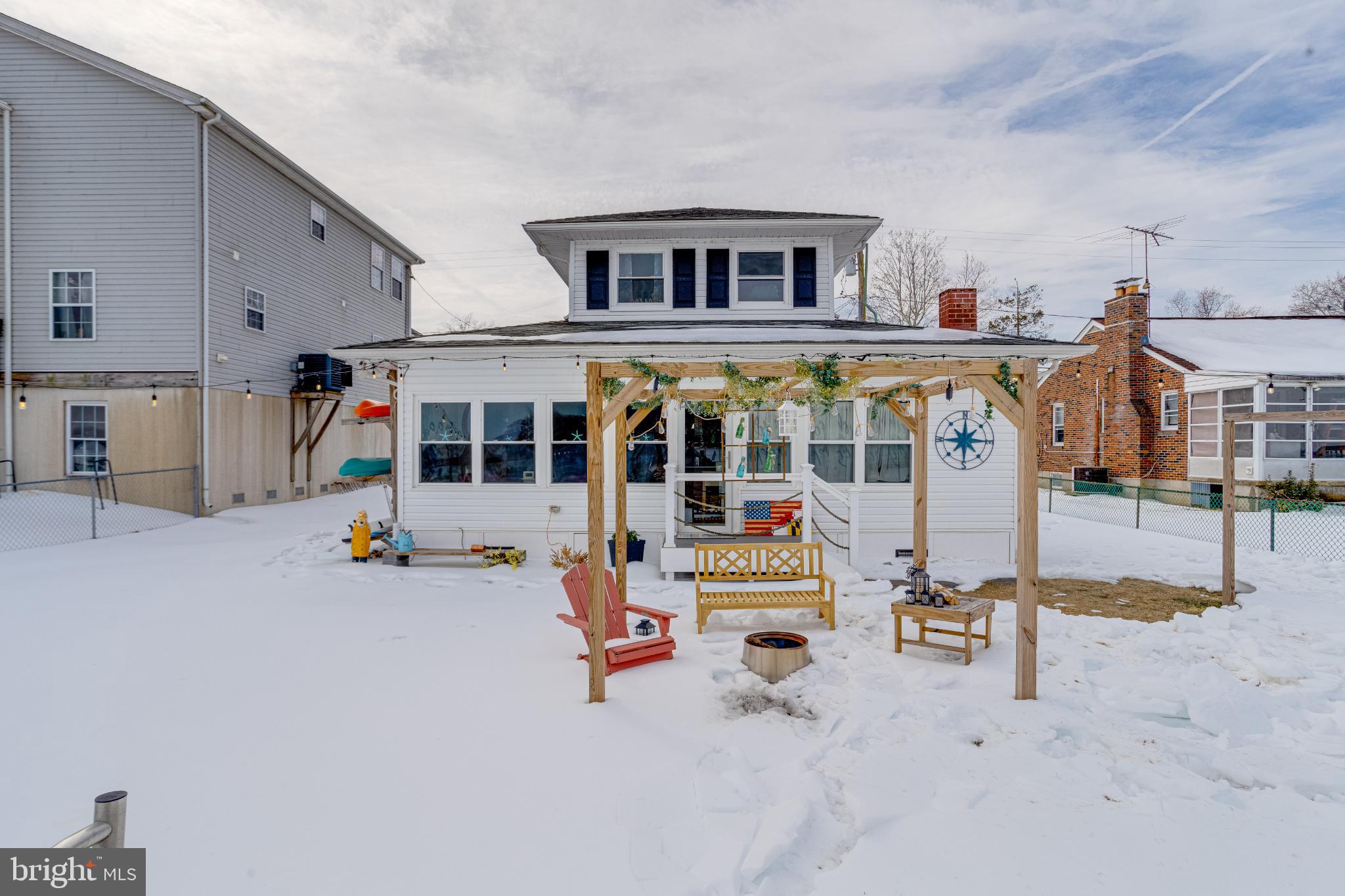 1815 Wilson Point Road Middle River, MD 21220 - Photo 48 of 76 a view of a house with backyard porch and sitting area