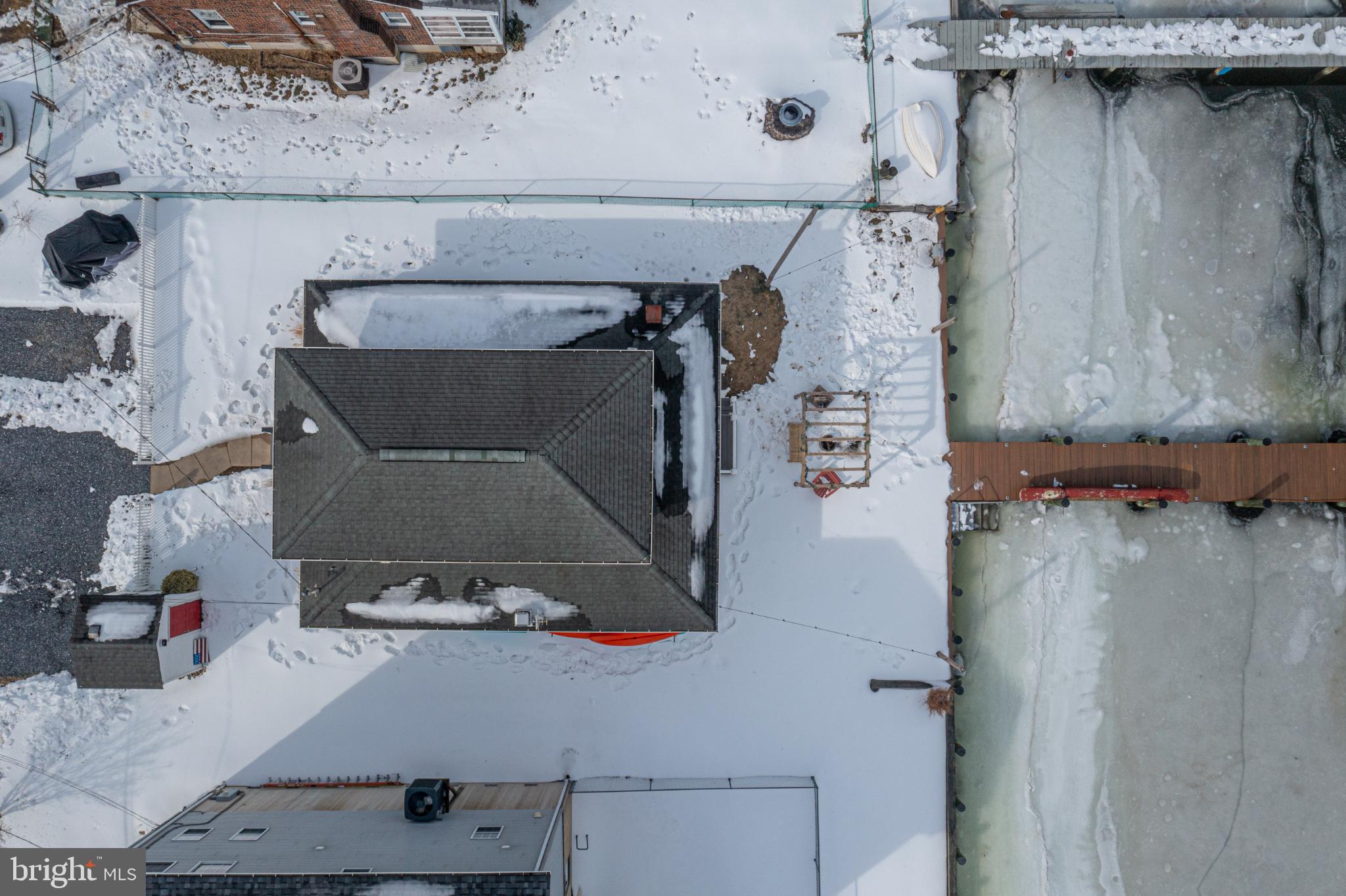 1815 Wilson Point Road Middle River, MD 21220 - Photo 73 of 76 Snow-covered retreat by the frozen waterway.