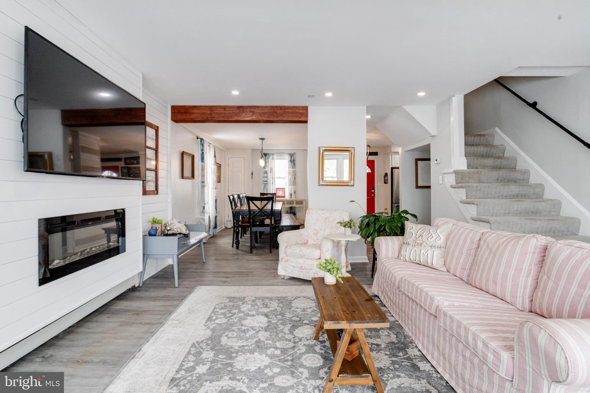 1815 Wilson Point Road Middle River, MD 21220 - Photo 9 of 76 a living room with furniture a fireplace and a flat screen tv