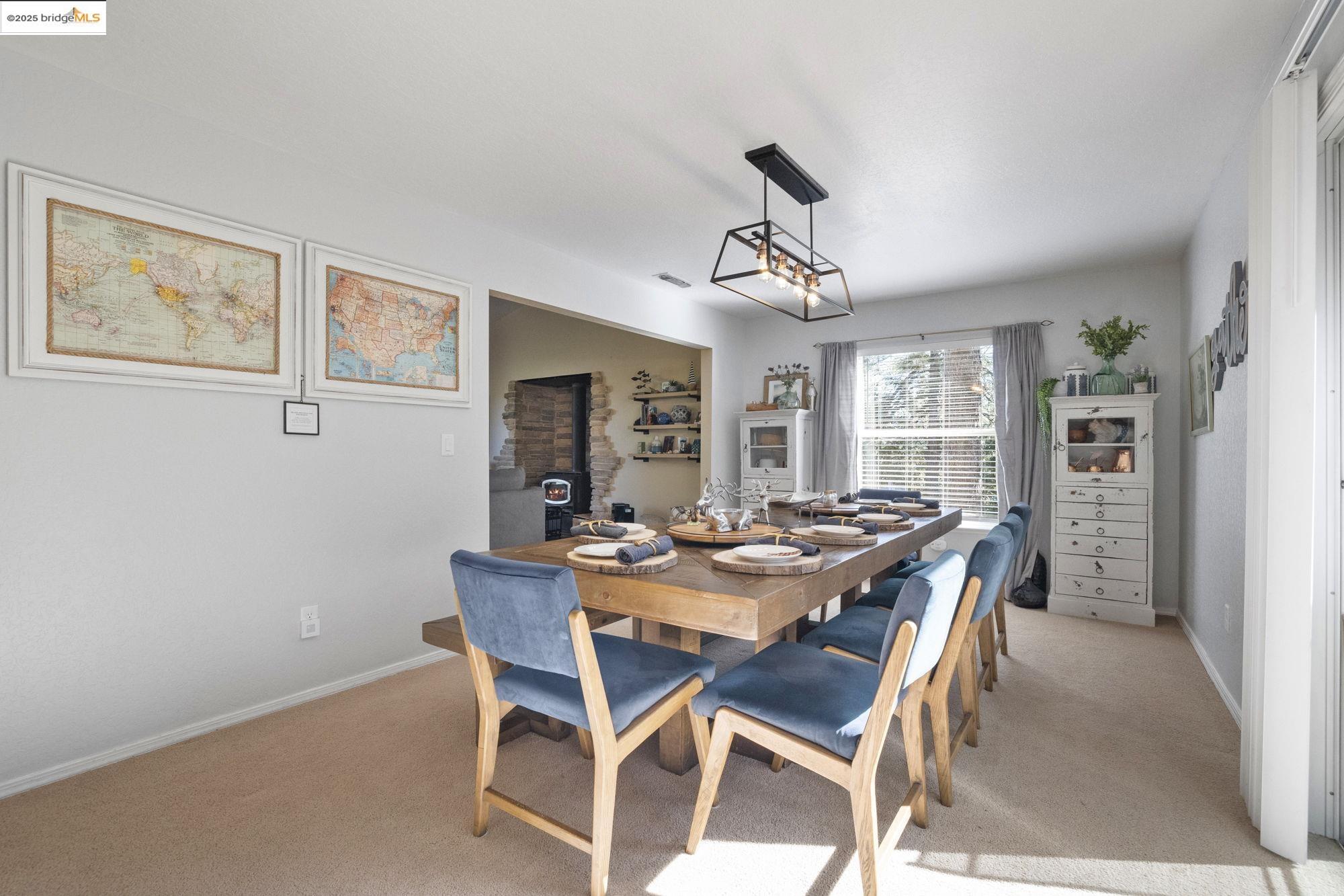 12080 Breckenridge Road Groveland, CA 95321 - Photo 11 of 48 a view of a dining room with furniture window and wooden floor