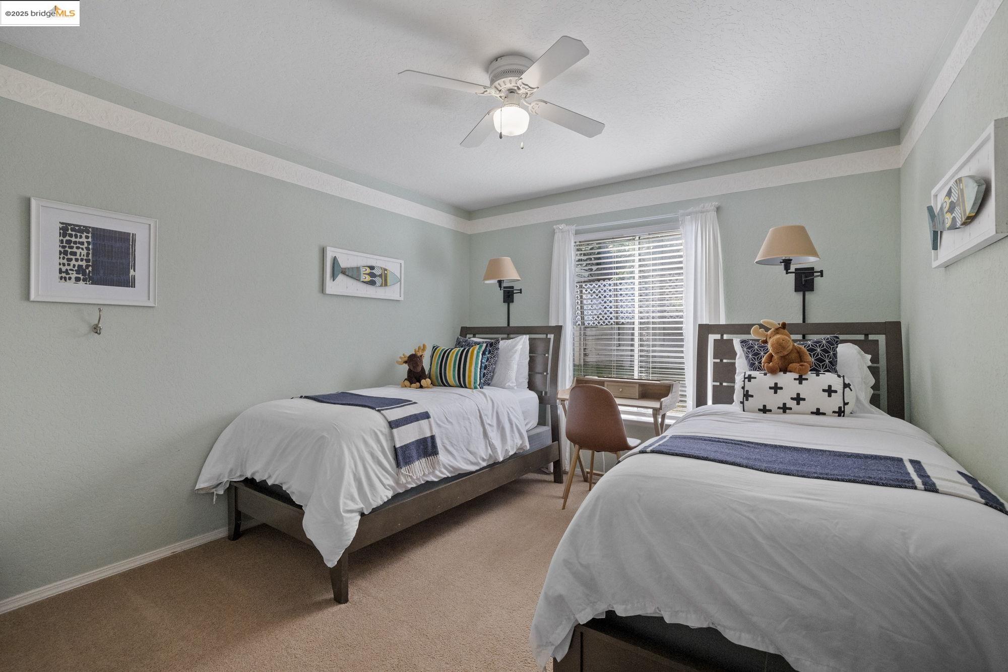 12080 Breckenridge Road Groveland, CA 95321 - Photo 16 of 48 a bedroom with two beds and a chandelier