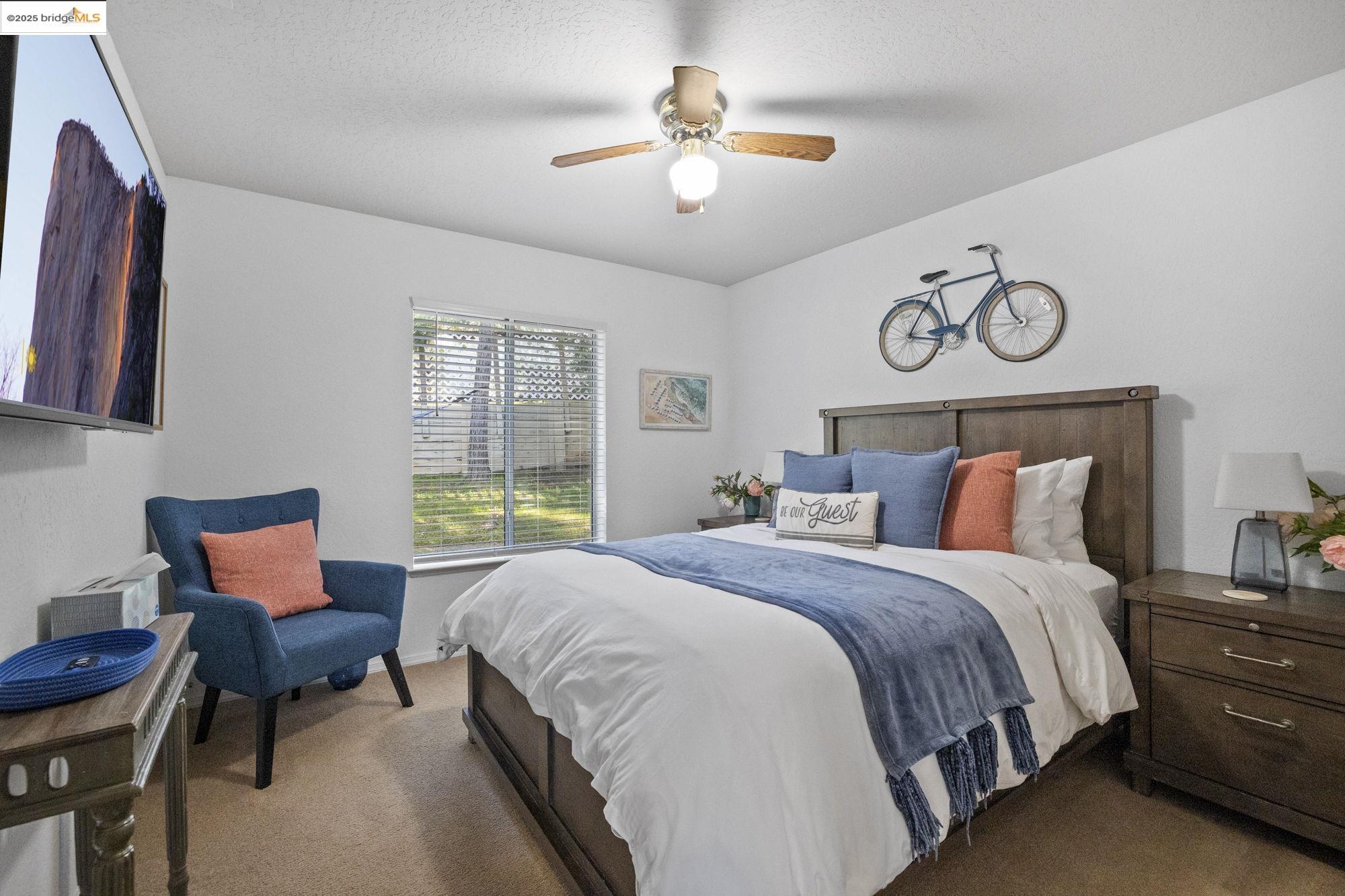 12080 Breckenridge Road Groveland, CA 95321 - Photo 17 of 48 a bedroom with a bed and chair
