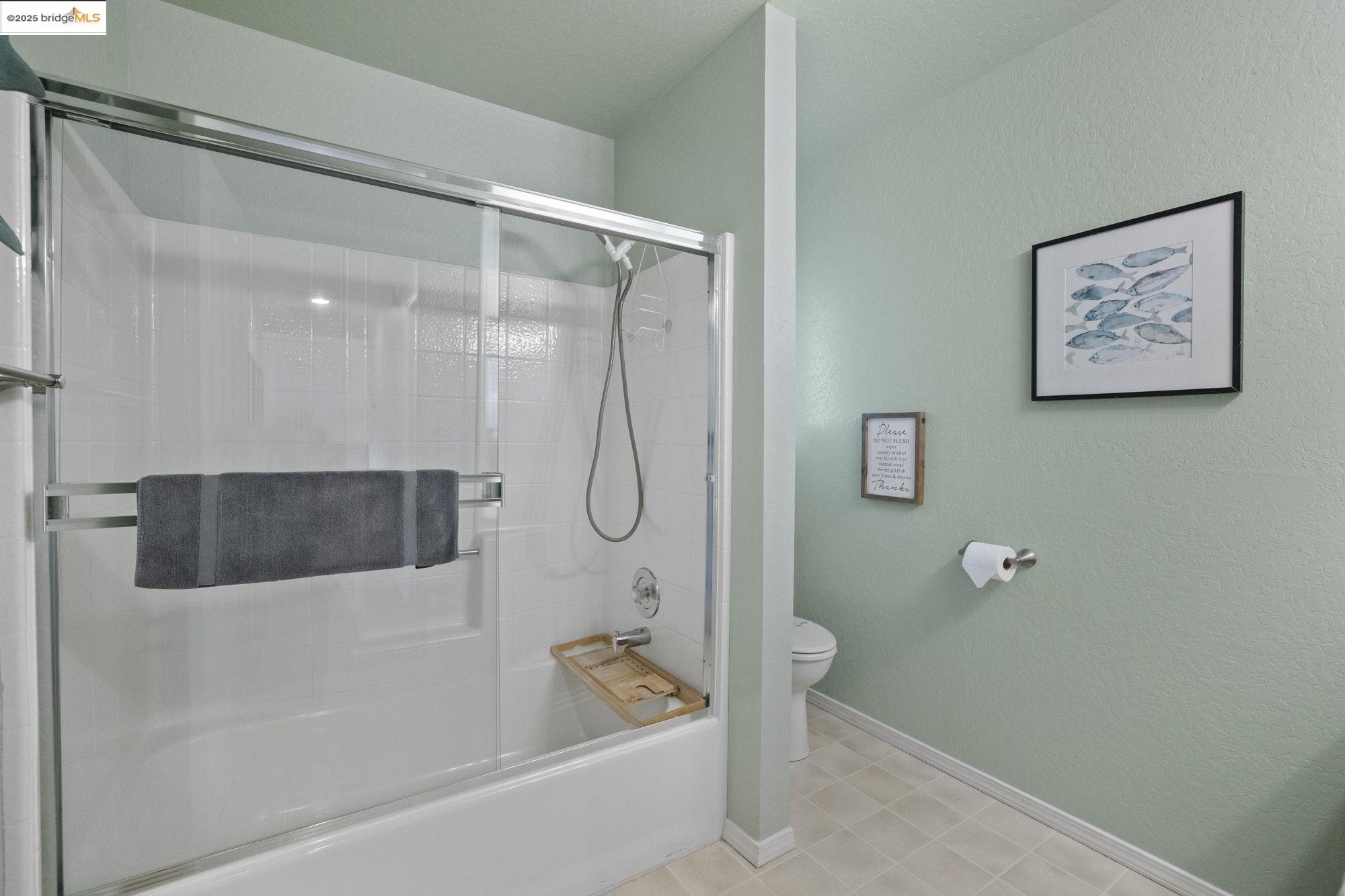 12080 Breckenridge Road Groveland, CA 95321 - Photo 18 of 48 a bathroom with a bathtub and a shower