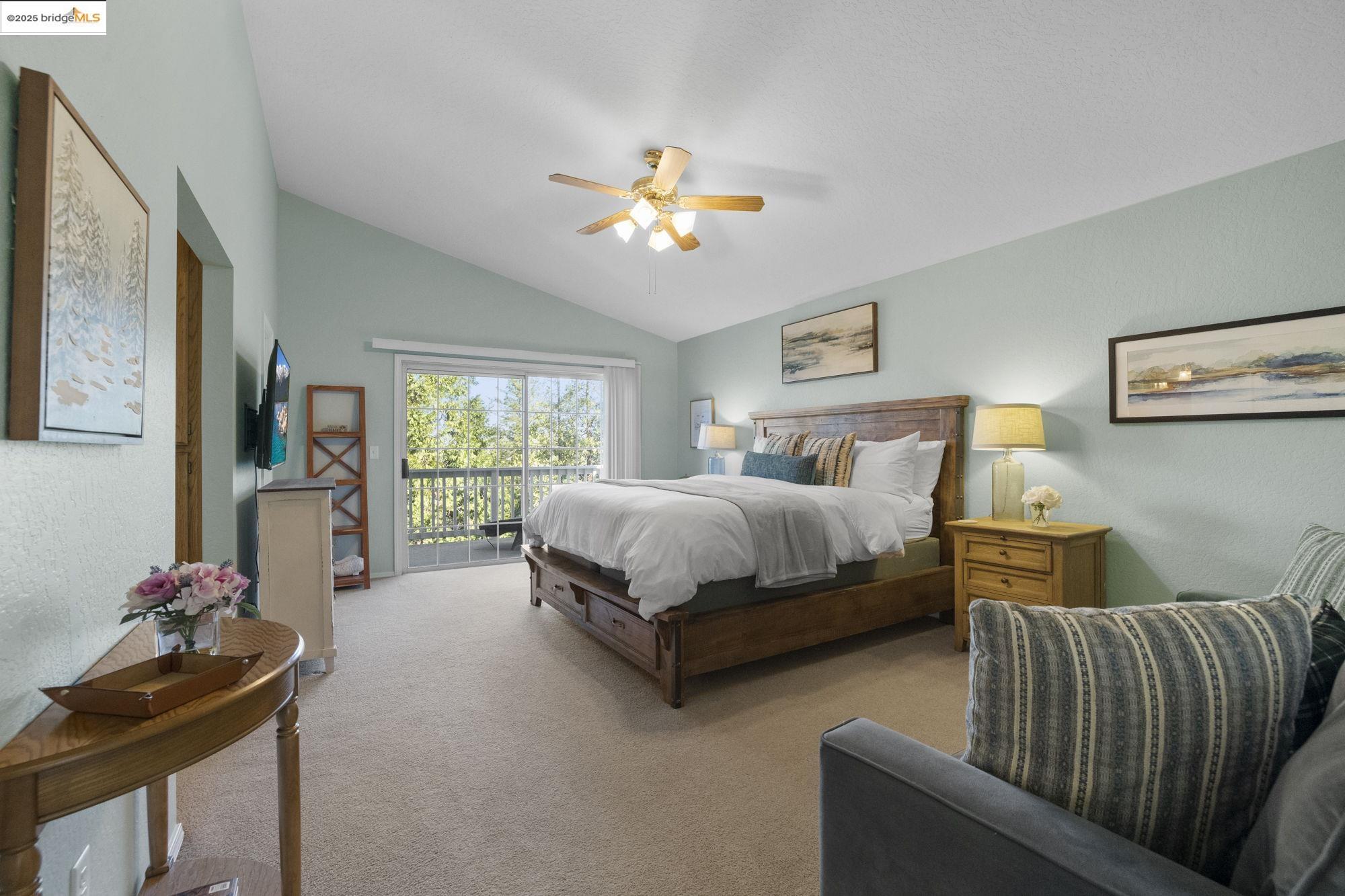 12080 Breckenridge Road Groveland, CA 95321 - Photo 20 of 48 a bedroom with bed a chandelier and a window