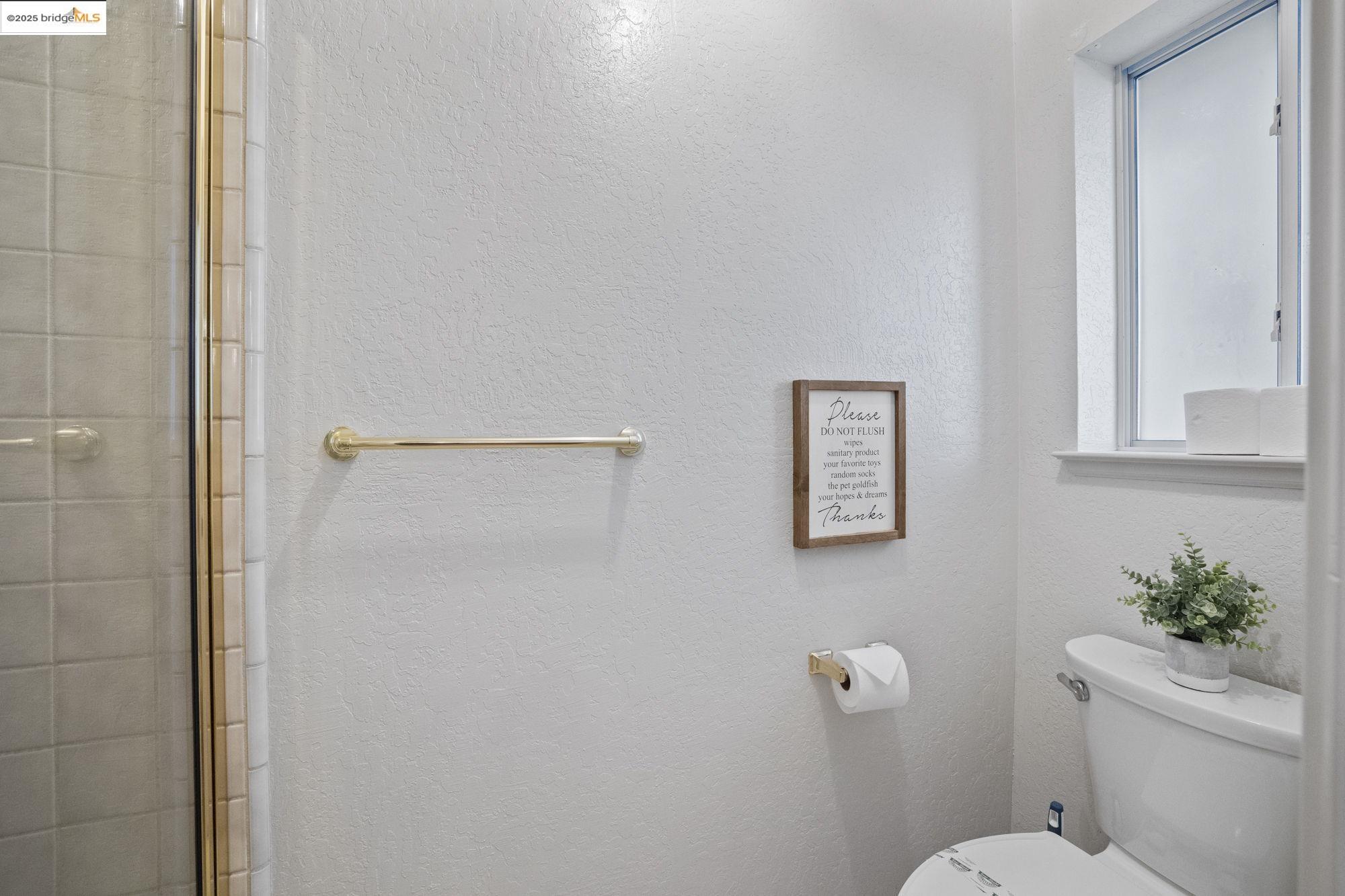 12080 Breckenridge Road Groveland, CA 95321 - Photo 23 of 48 a white toilet sitting next to a shower
