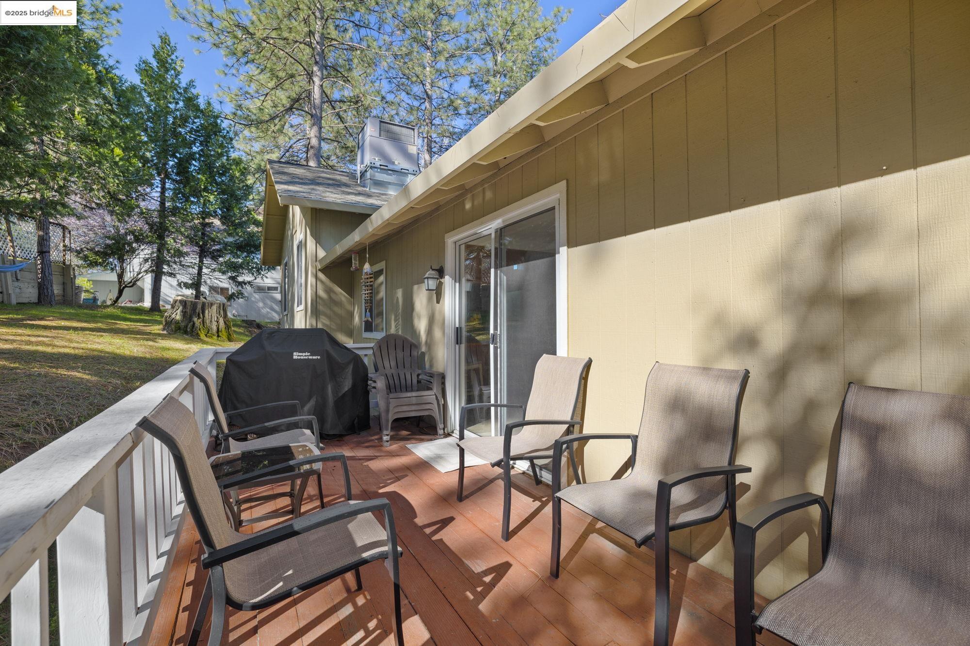 12080 Breckenridge Road Groveland, CA 95321 - Photo 28 of 48 a view of a patio with table and chairs and potted plants