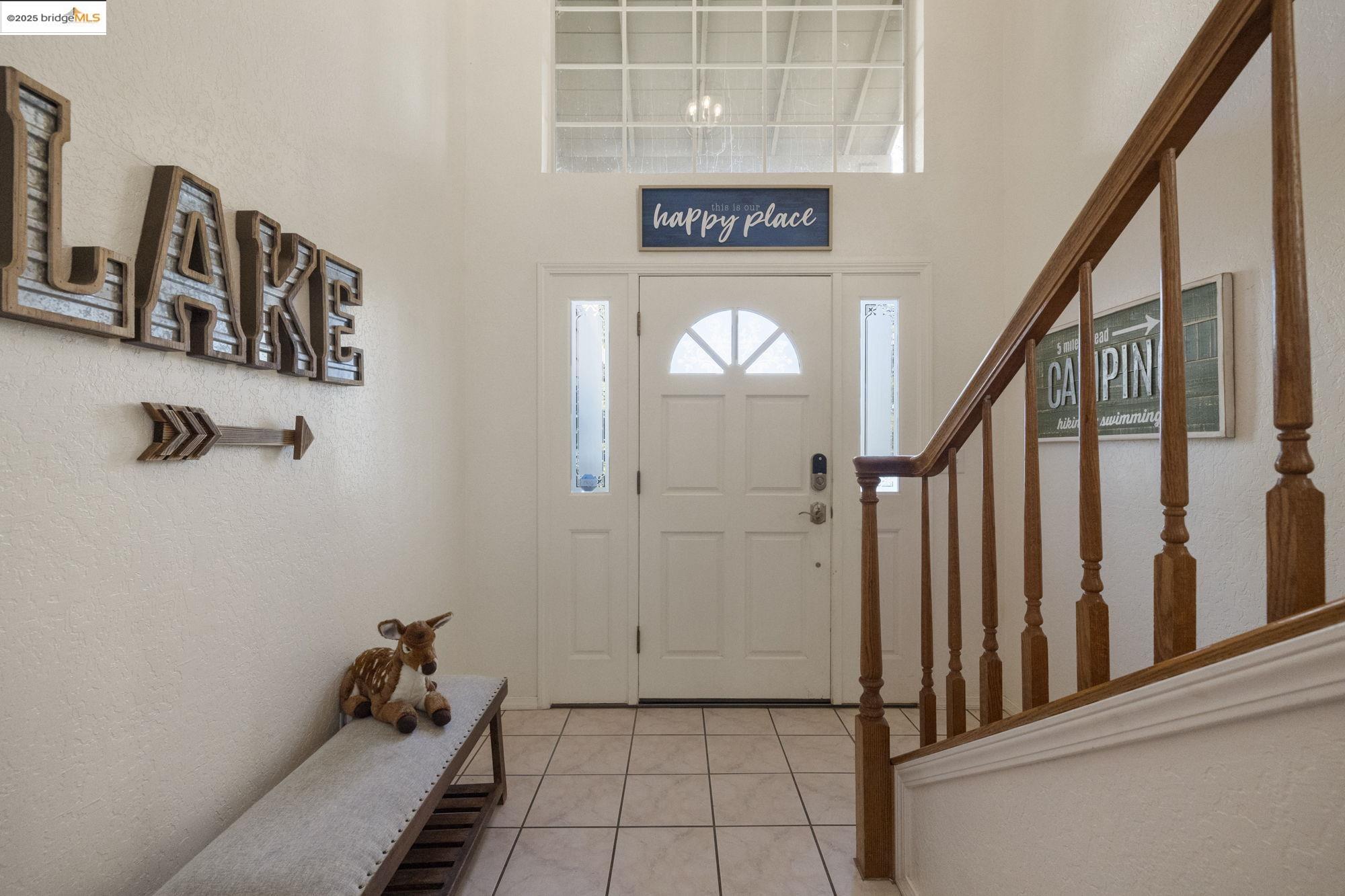 12080 Breckenridge Road Groveland, CA 95321 - Photo 3 of 48 a view of a hallway with wooden staircase and stairs