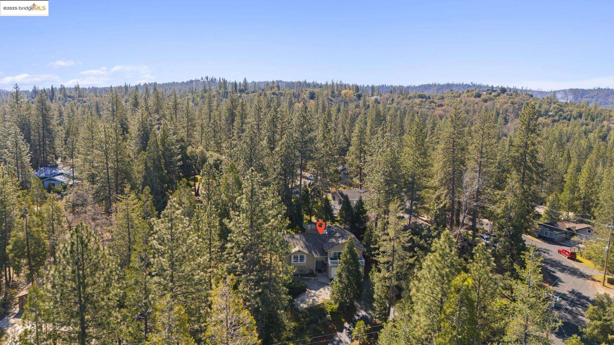12080 Breckenridge Road Groveland, CA 95321 - Photo 31 of 48 a view of a city with lush green forest
