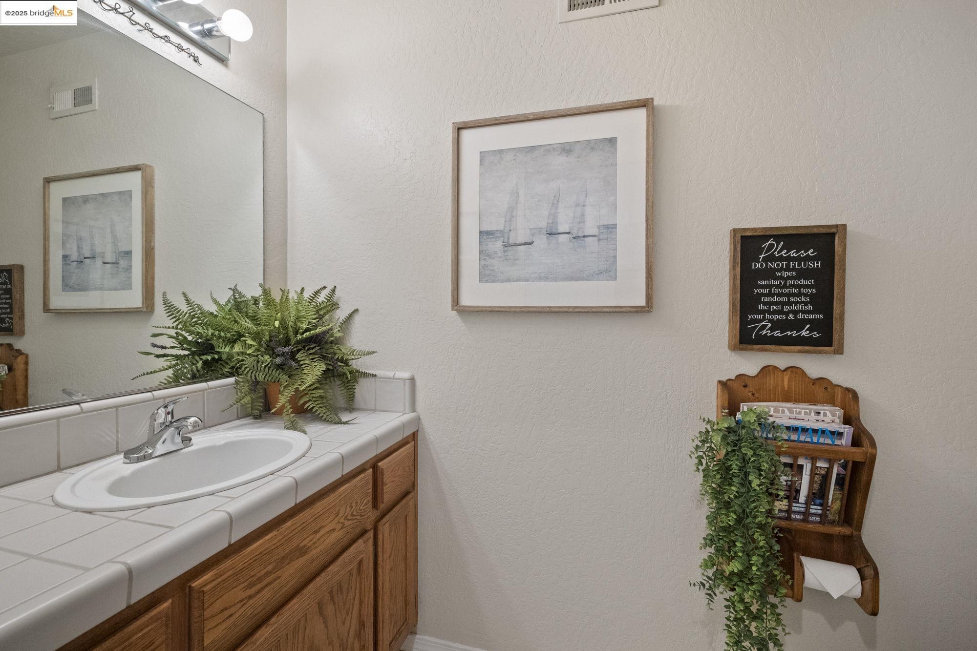 12080 Breckenridge Road Groveland, CA 95321 - Photo 37 of 48 a bathroom with a sink and a mirror