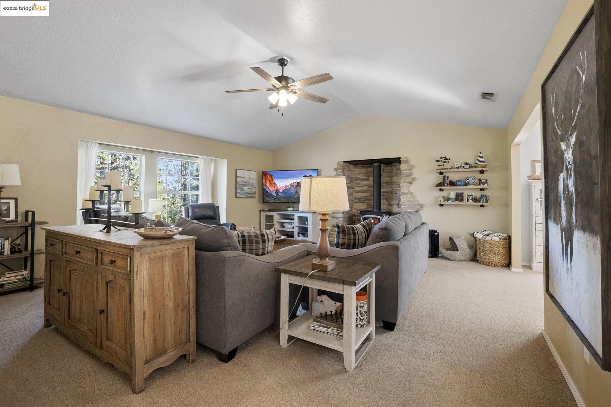 12080 Breckenridge Road Groveland, CA 95321 - Photo 5 of 48 a living room with furniture and a chandelier