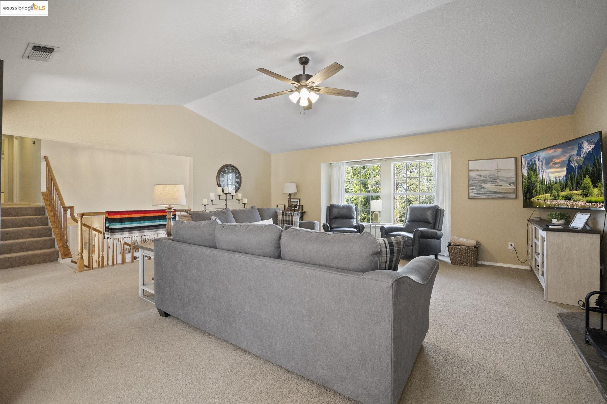 12080 Breckenridge Road Groveland, CA 95321 - Photo 6 of 48 a living room with furniture and a flat screen tv