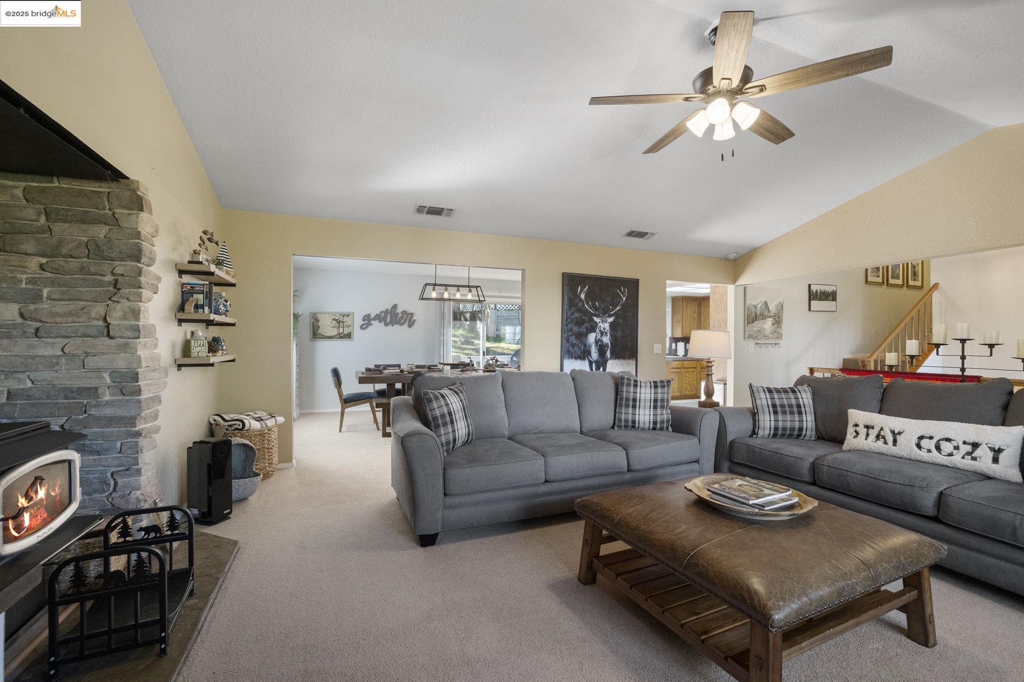 12080 Breckenridge Road Groveland, CA 95321 - Photo 8 of 48 a living room with furniture and a fireplace