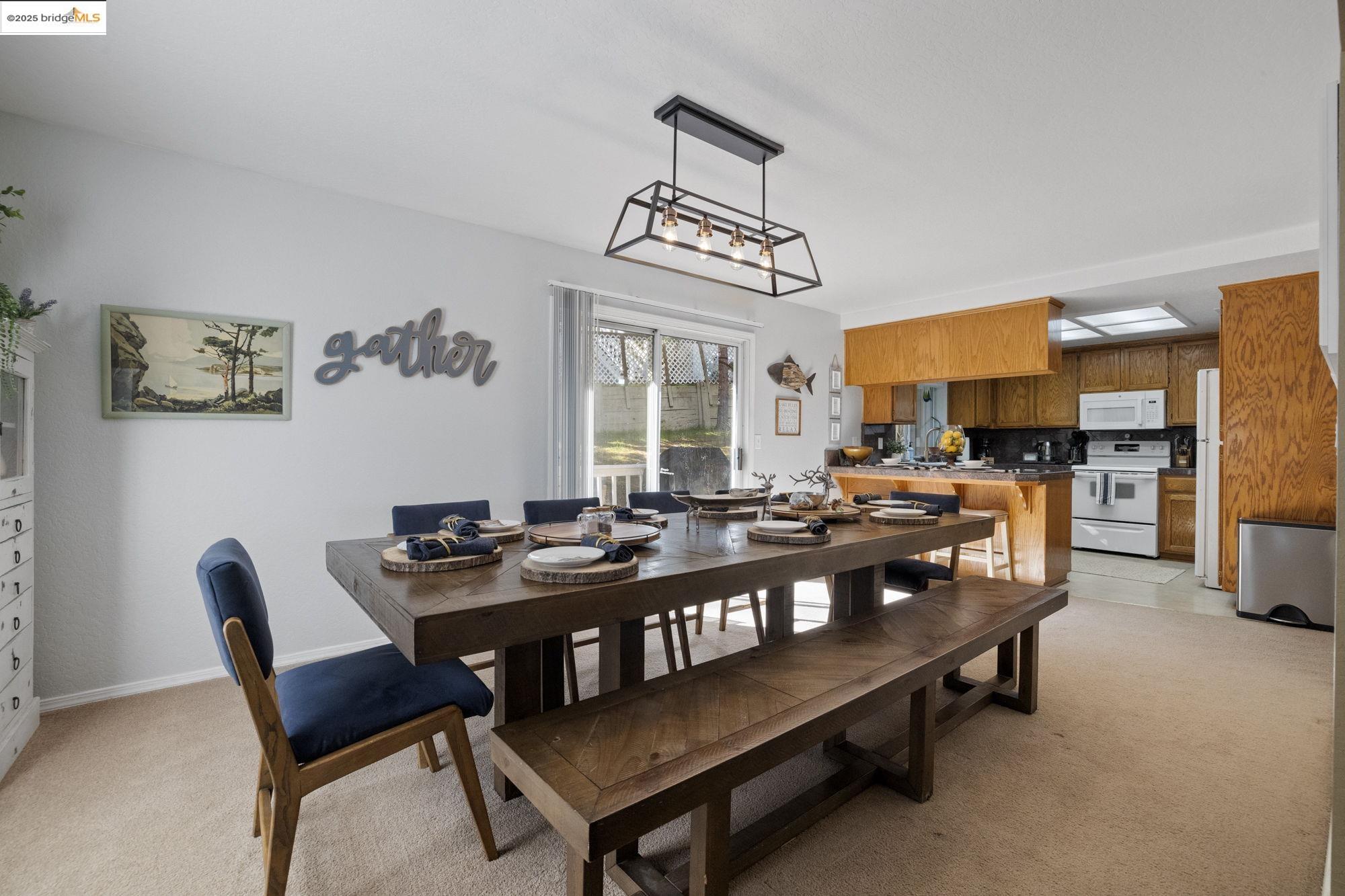 12080 Breckenridge Road Groveland, CA 95321 - Photo 9 of 48 a view of a dining room with furniture and a chandelier