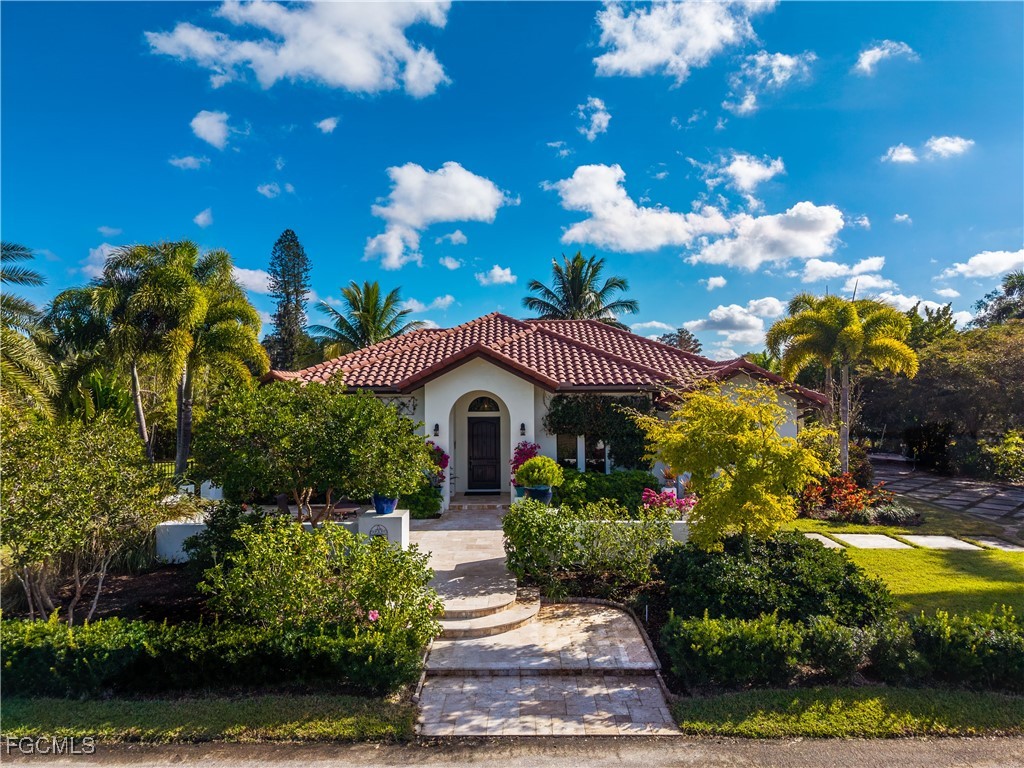 1971 Mitchell Avenue Alva, FL 33920 - Photo 2 of 50 a front view of a house with a yard and outdoor seating