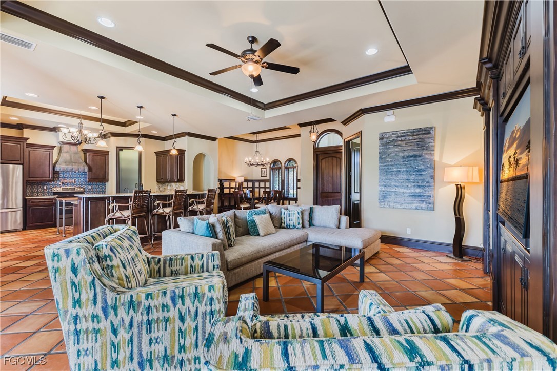 1971 Mitchell Avenue Alva, FL 33920 - Photo 25 of 50 a living room with lots of furniture wooden floor and a flat screen tv