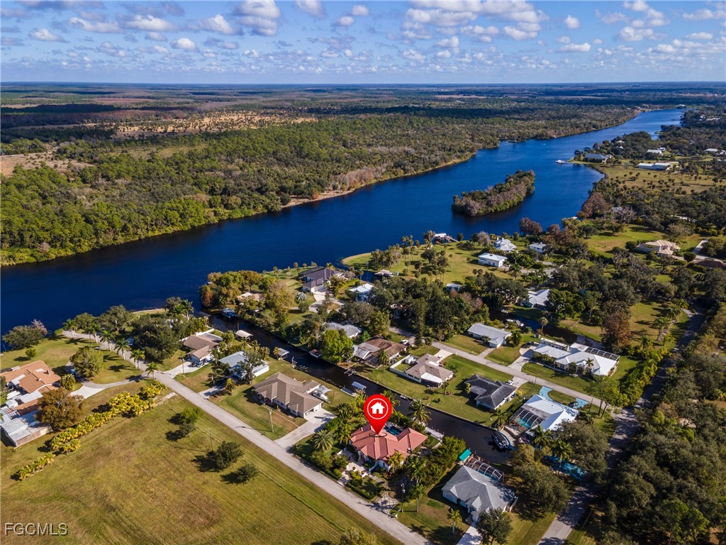 1971 Mitchell Avenue Alva, FL 33920 - Photo 47 of 50 a view of a balcony with wooden floor and a yard