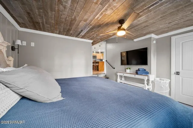 a kitchen with granite countertop a table and chairs in it