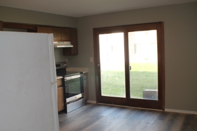 2902 31st Street, Unit 6 Zion, IL 60099 - Photo 2 of 7 a kitchen with a window a sink and a stove