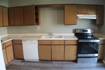 2902 31st Street, Unit 6 Zion, IL 60099 - Photo 4 of 7 a kitchen with a sink cabinets and appliances