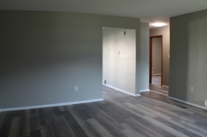 2902 31st Street, Unit 6 Zion, IL 60099 - Photo 7 of 7 a view of an empty room with wooden floor and closet