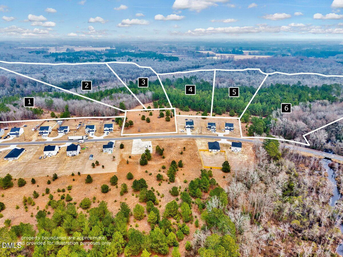 Lot 4 Blue Springs Road Red Springs, NC 28377 - Photo 8 of 9 a view of swimming pool with outdoor seating and a lots of buildings in the background