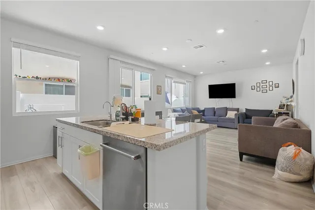 a view of living room with granite countertop furniture and fireplace