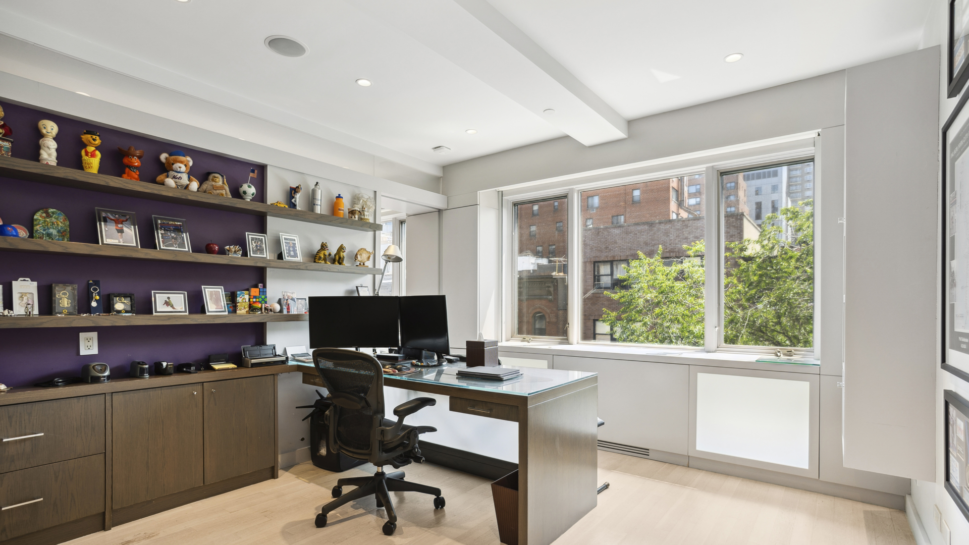 435 East 76th Street, Unit 6A Manhattan, NY 10021 - Photo 8 of 13 a view of workspace with a bookshelf