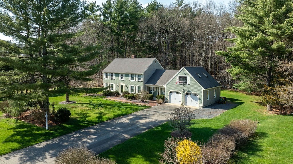 58 Buttercup Lane Hanover, MA 02339 - Photo 1 of 35 a house with trees in the background