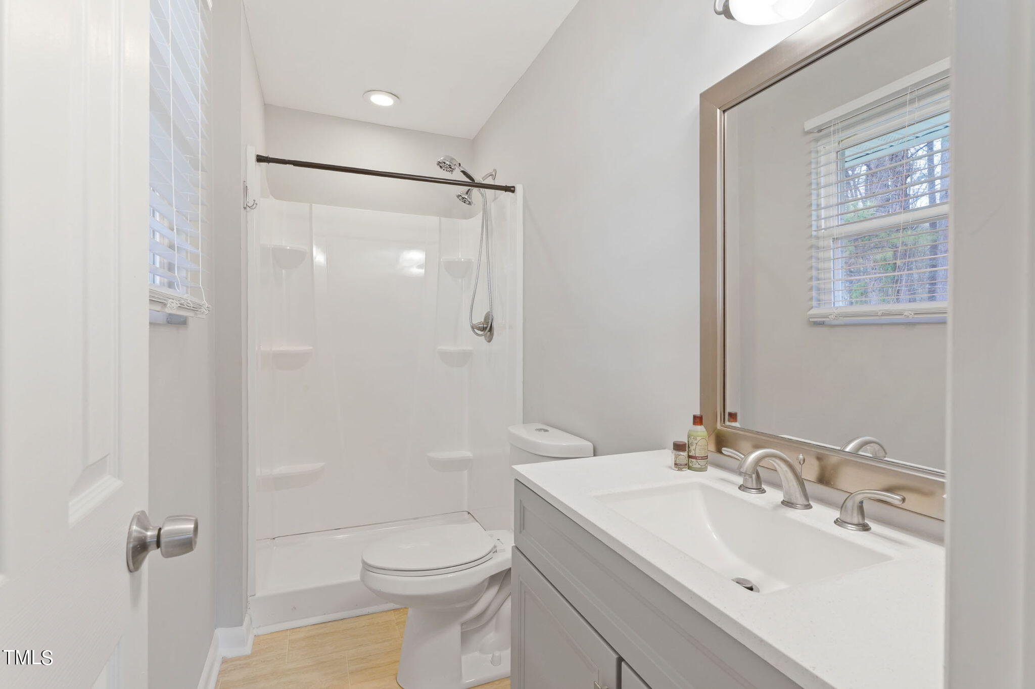 1005 Delray Street Durham, NC 27713 - Photo 13 of 18 a bathroom with a sink toilet and shower