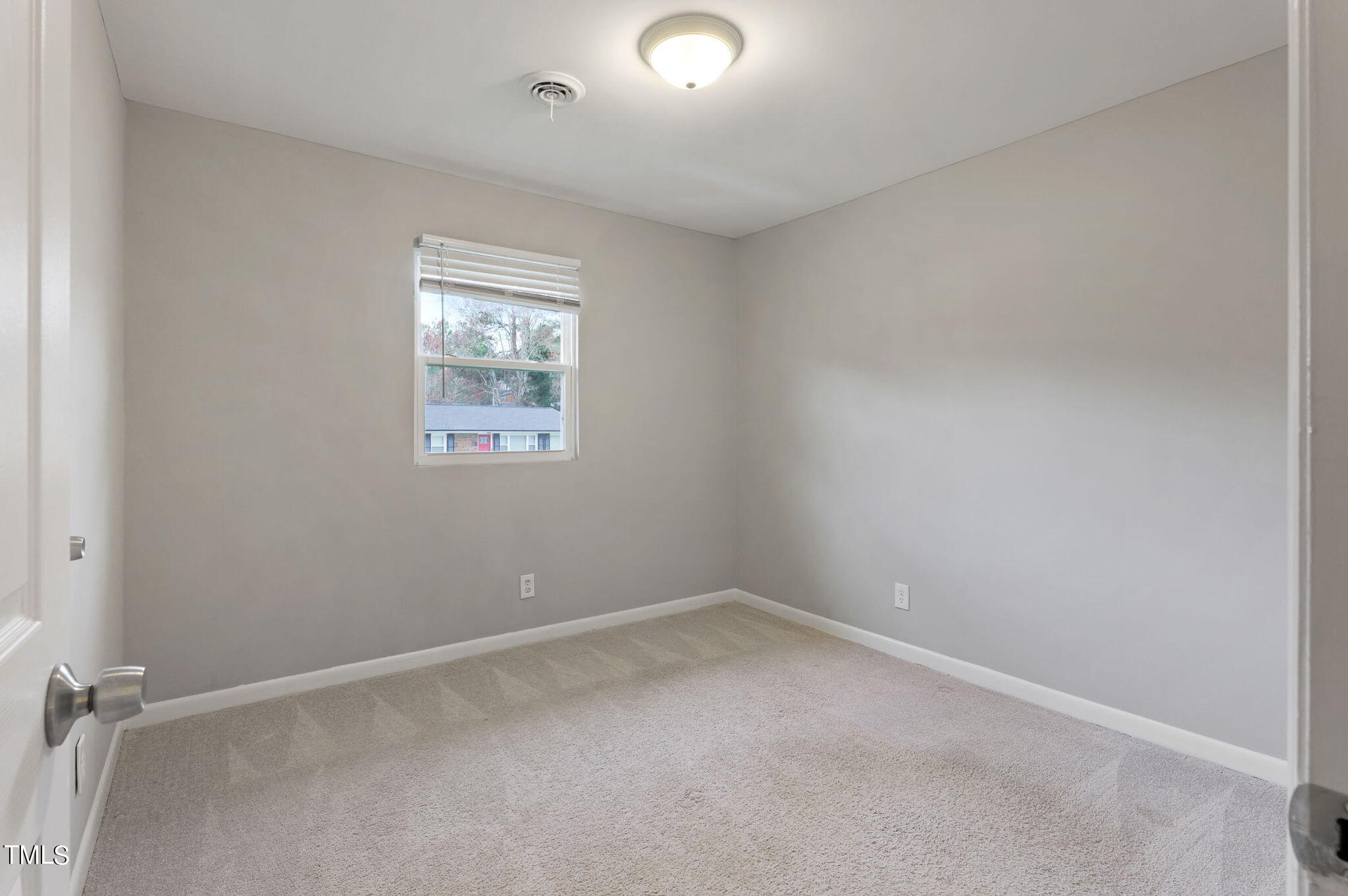 1005 Delray Street Durham, NC 27713 - Photo 14 of 18 an empty room with a window