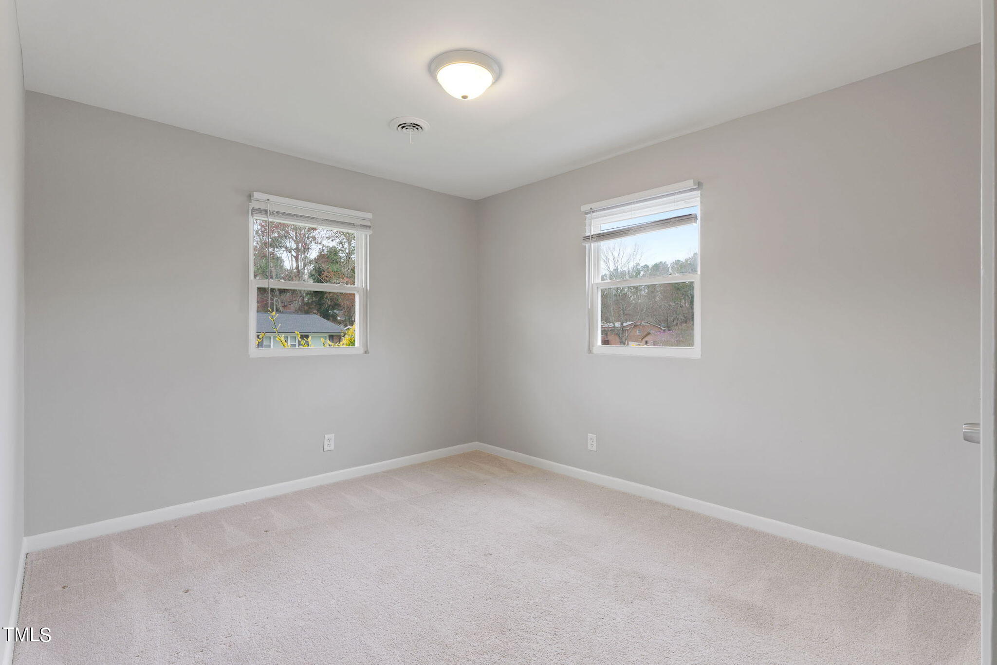 1005 Delray Street Durham, NC 27713 - Photo 16 of 18 an empty room with windows