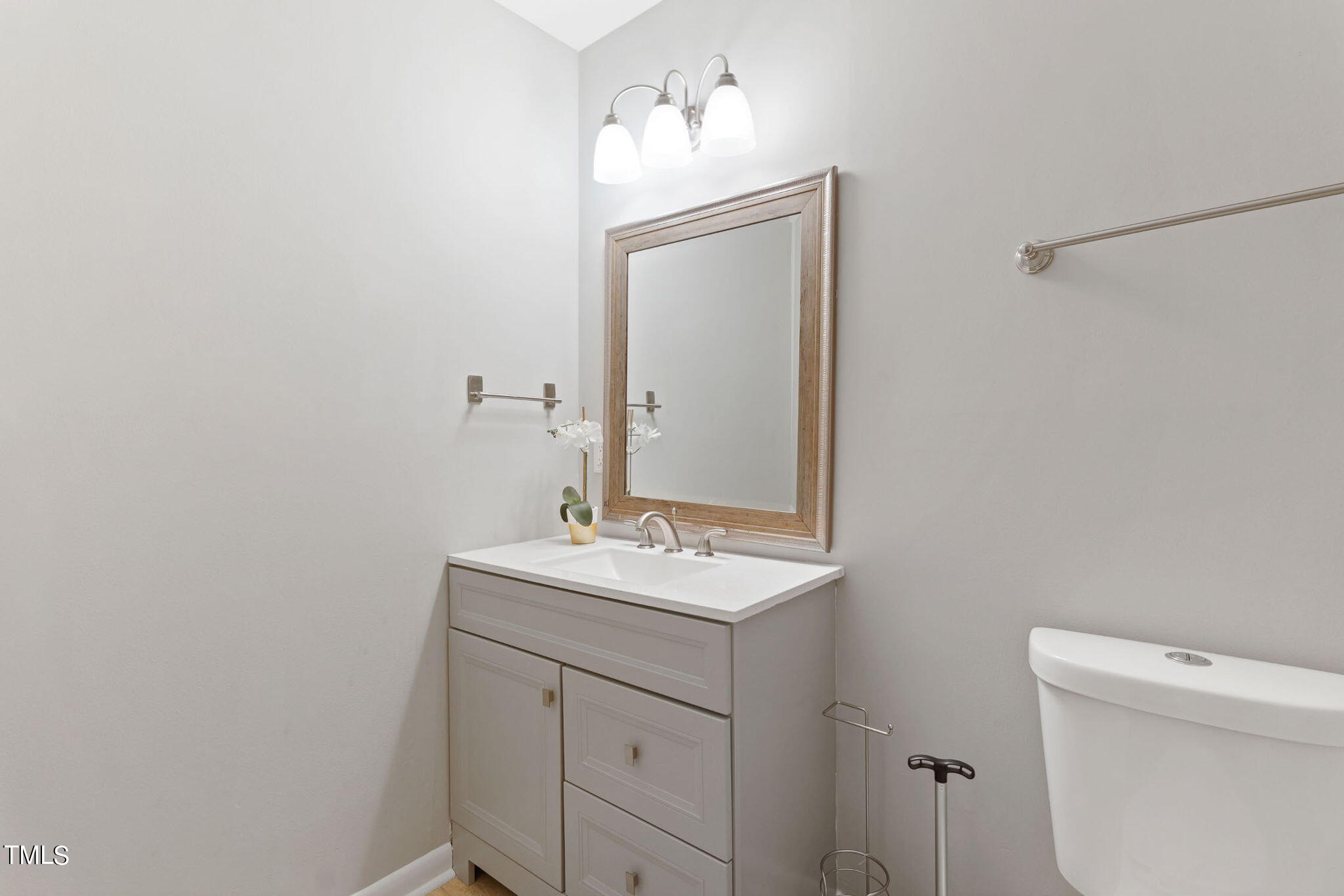 1005 Delray Street Durham, NC 27713 - Photo 17 of 18 a bathroom with a sink toilet and mirror