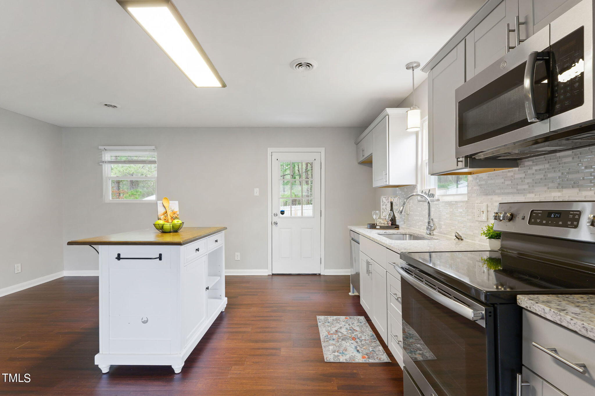 1005 Delray Street Durham, NC 27713 - Photo 4 of 18 a kitchen with a sink appliances and cabinets