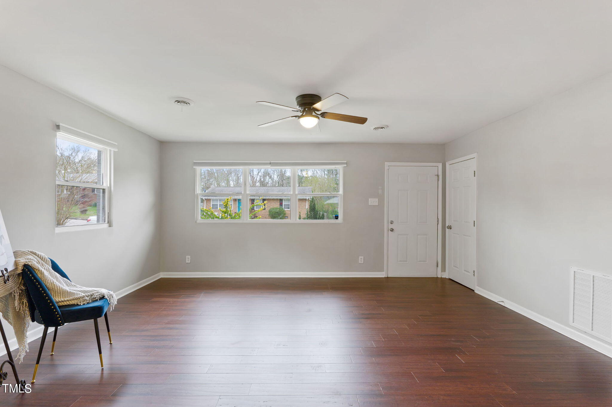 1005 Delray Street Durham, NC 27713 - Photo 9 of 18 a view of an empty room with wooden floor and a window