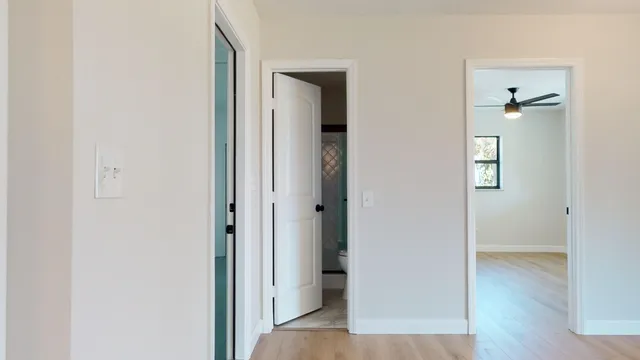 a view of a room with wooden floor